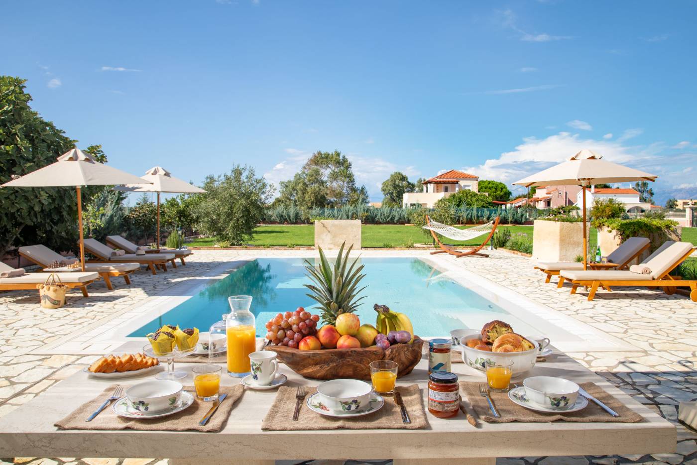 Breakfast laid by the private pool at Villa Rose Corfu