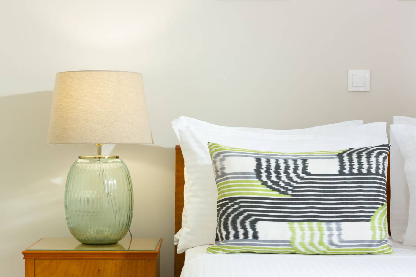 Venti di Paxos II — bedside detail with green glass lamp